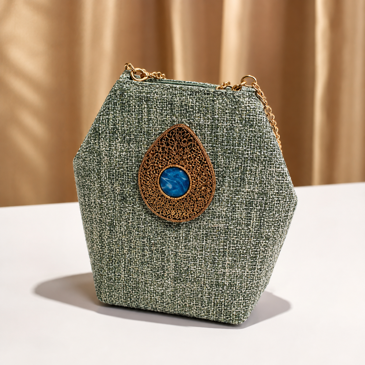 Crafted from premium textured fabric with a durable inner lining, gold-tone hardware Bag