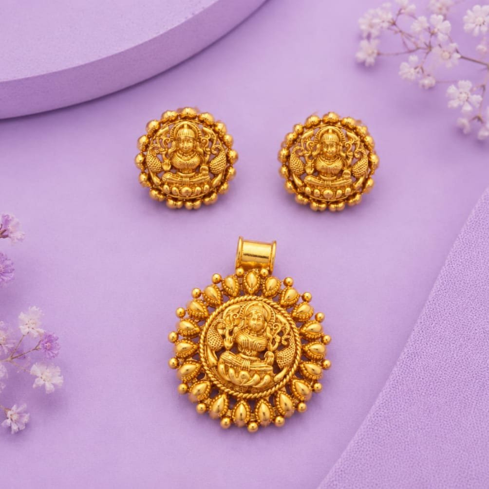 Temple jewellery pendant featuring an embossed figure of Goddess Lakshmi surrounded by a beaded border.